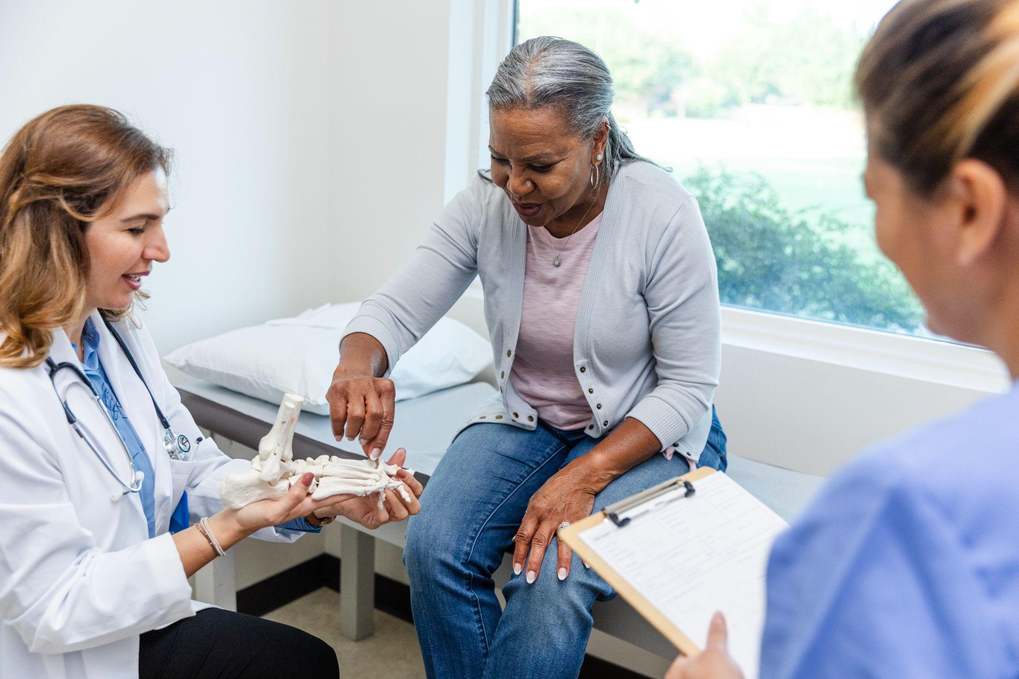 An older adult at the doctors for her bone health